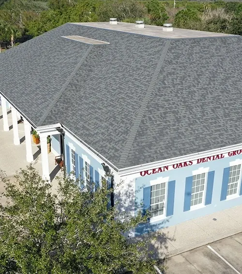 The building from above, with its hipped roof and car park.